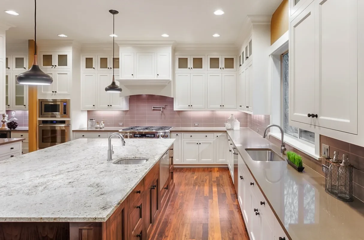 Spacious kitchen with white cabinets