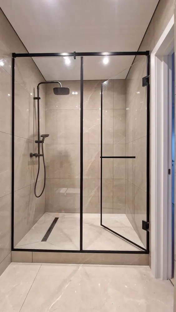 Modern glass shower enclosure with black frame