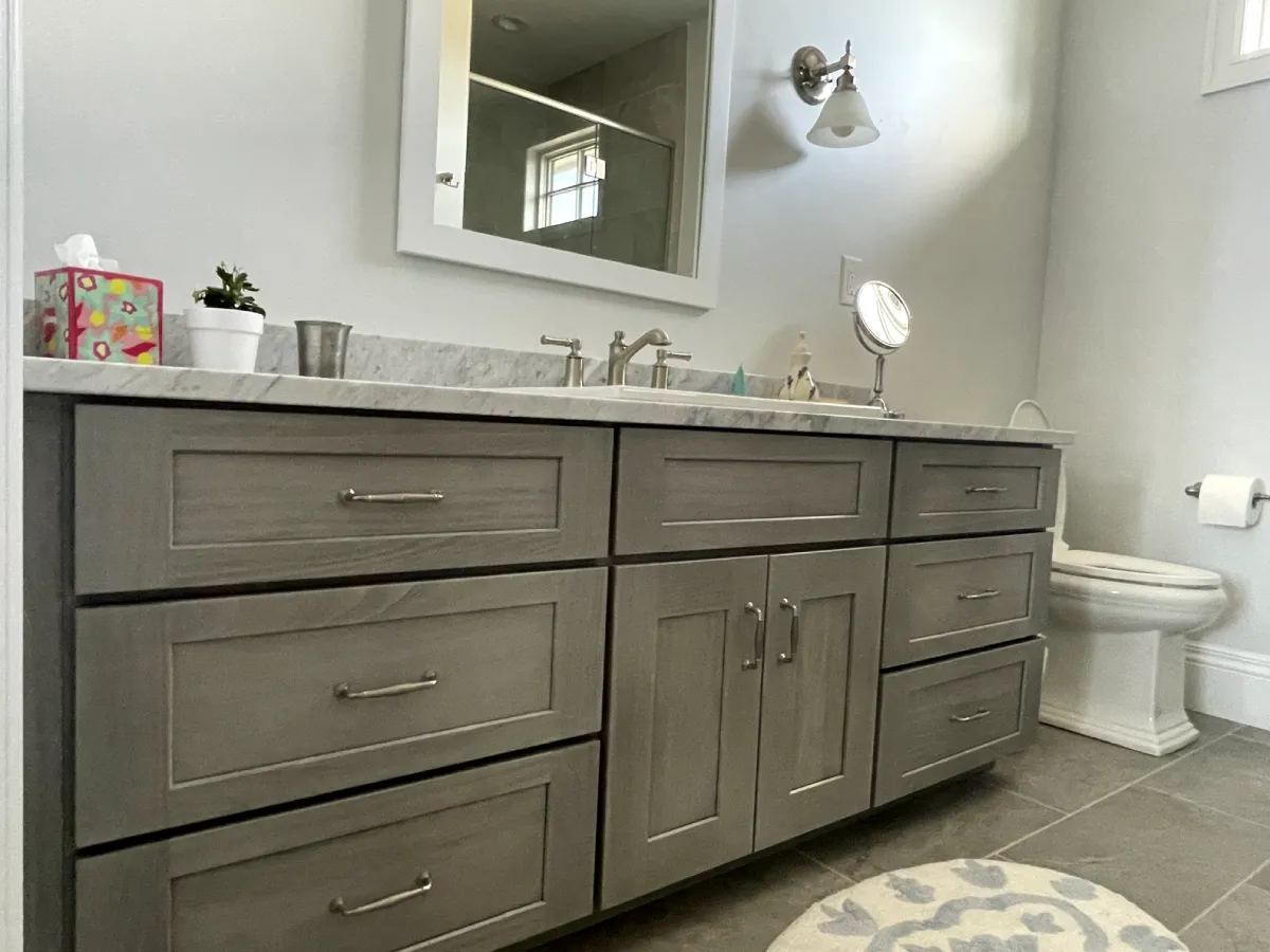 Elegant bathroom with gray cabinets