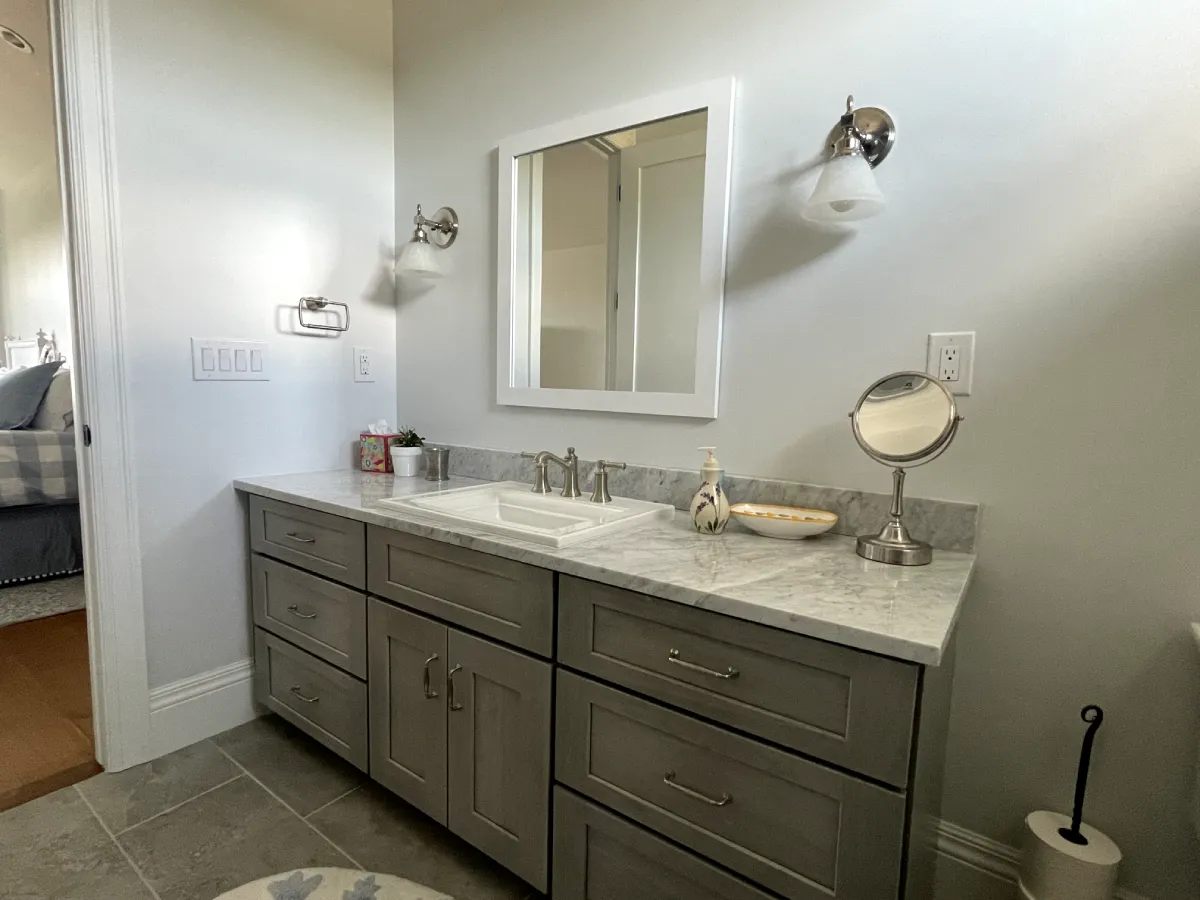 Spacious bathroom with stylish lighting