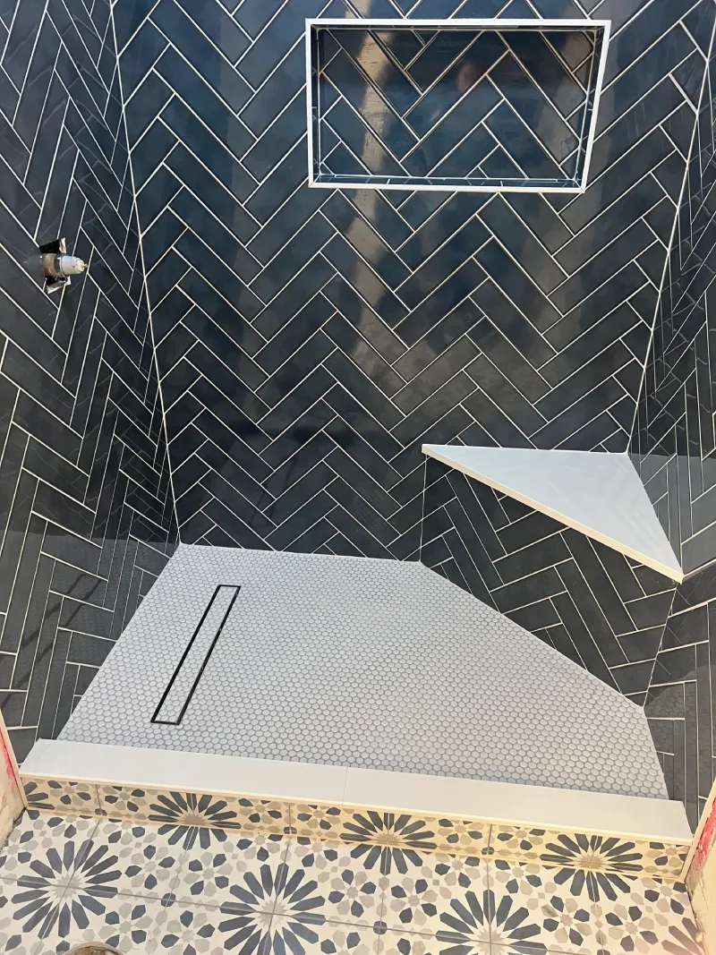 Black and white tiled shower interior