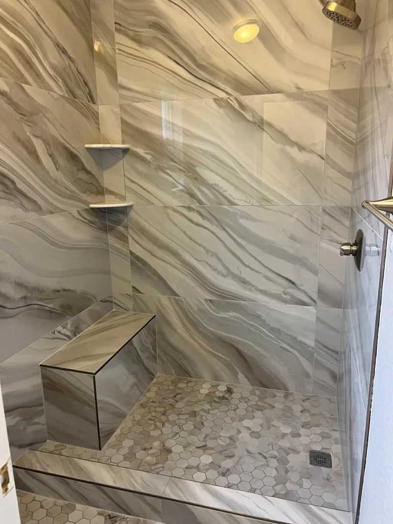 Modern marble shower with bench