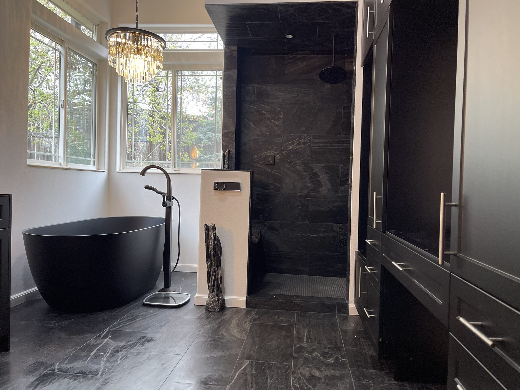 Modern bathroom with black fixtures and natural light.