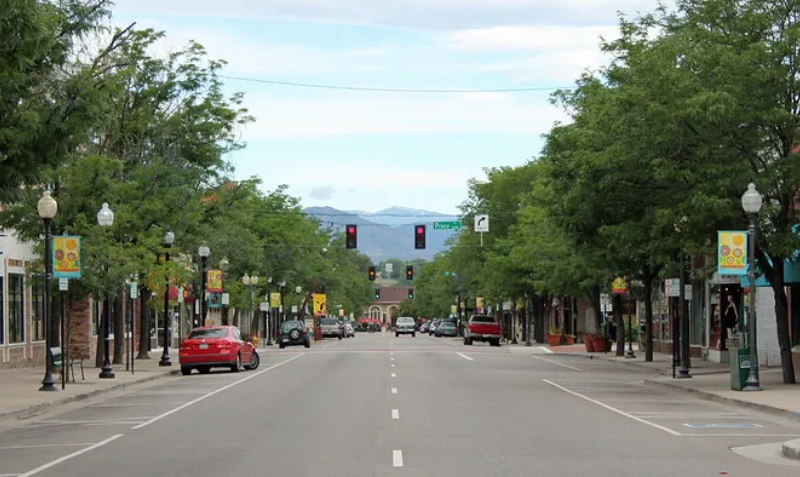 Quiet urban road with parked cars
